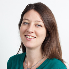 Headshot photo of Sophie du Sautoy. A white women with should length brown hair wearing a green top.
