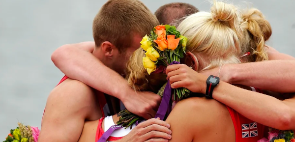 Images of athletes hugging after winning.