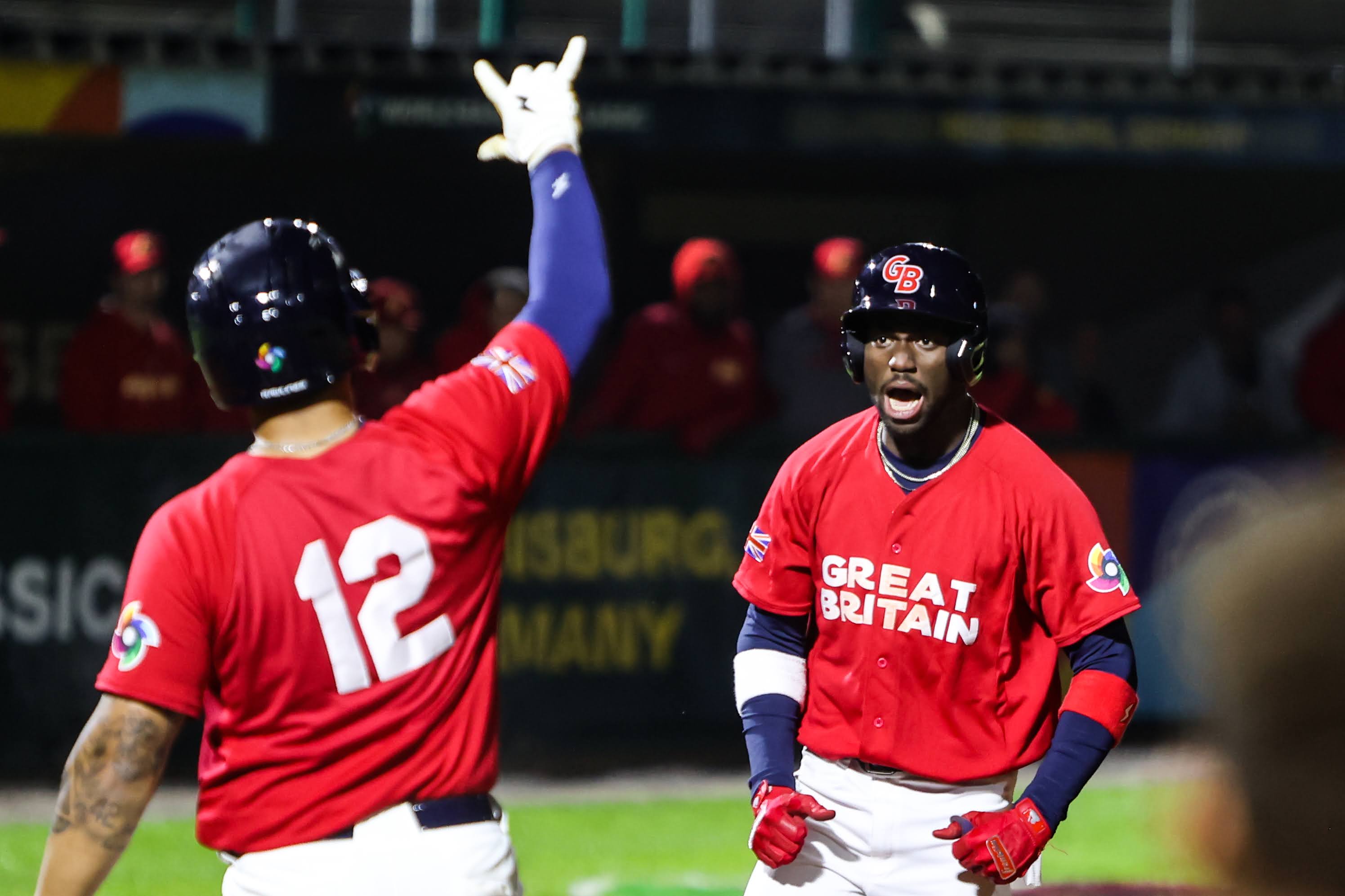 GB baseball players celebrating after a game