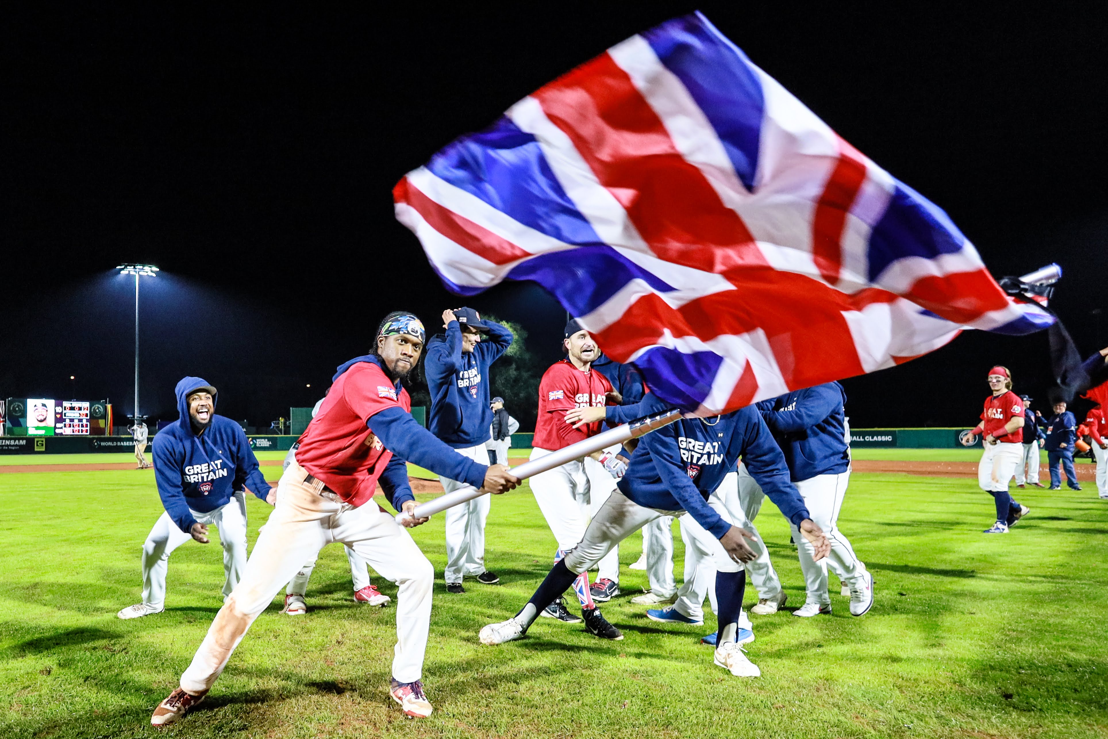 GB baseball players celebrating after a game