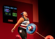 Emily Campbell shouts and celebrates after a successful medal winning lift at the Tokyo 2020 Olympic Games.