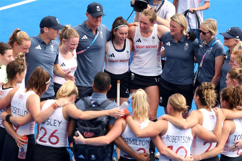 Players and staff of Team GB huddle together following the Women's Pool B match between South Africa and Great Britain on day five of the Olympic Games Paris 2024.