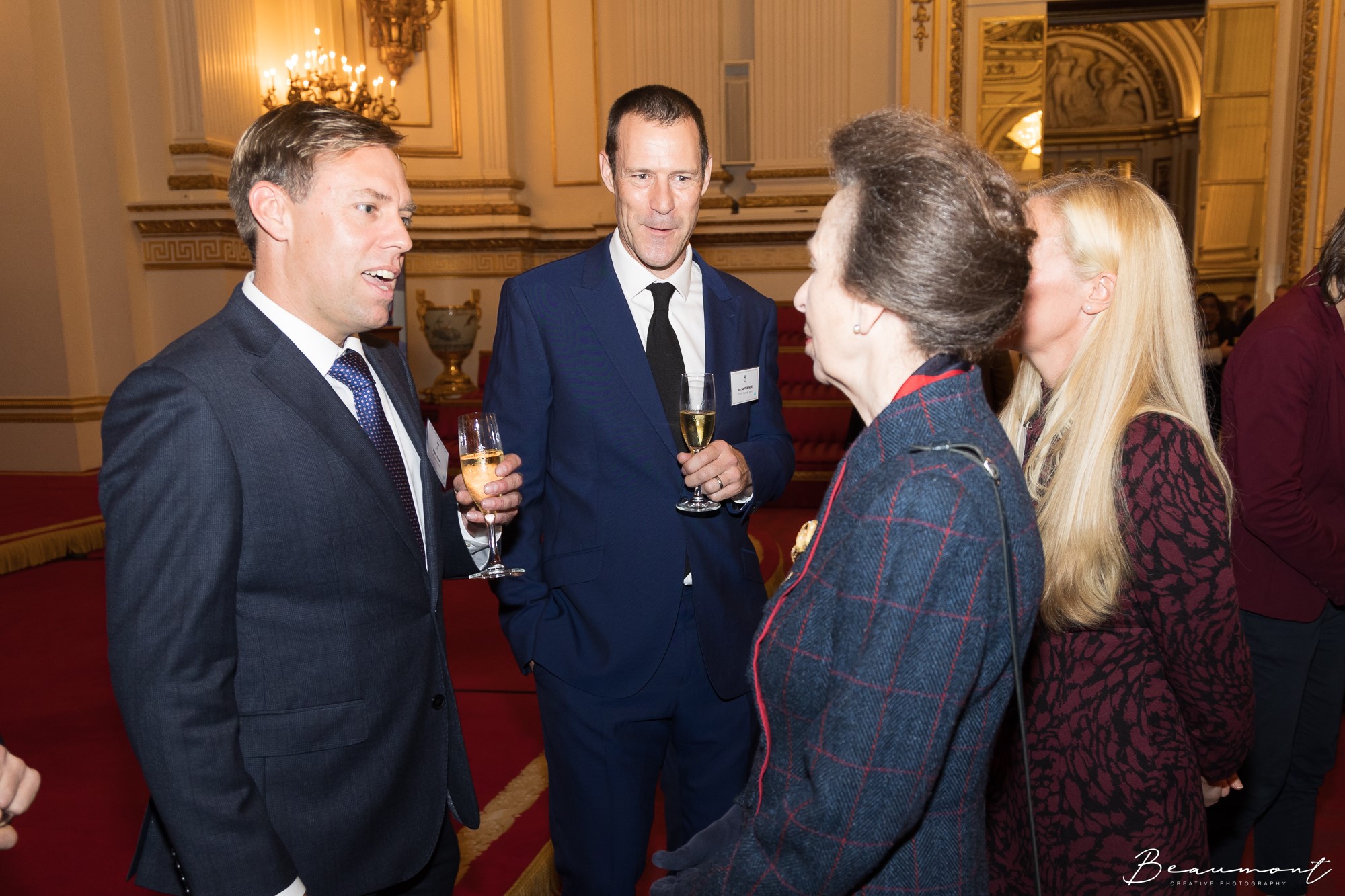 HRH The Princess Royal with her back to camera talking to Adam Elliott, Jon Norfolk and Kate Baker