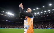 Kevin Sinvfield claps to the crowd as he completes his running challenge at the RLWC2021 final, Old Trafford, Greater Manchester