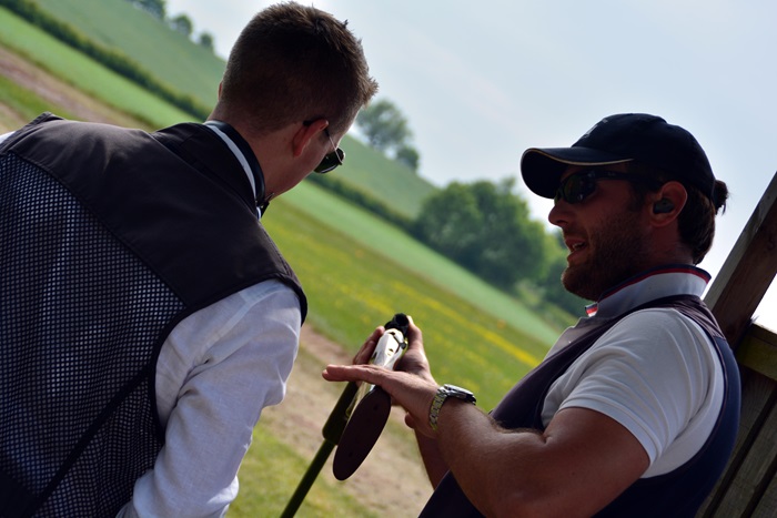 British shooting coach, Lee Campion working with an athlete in the shooting range