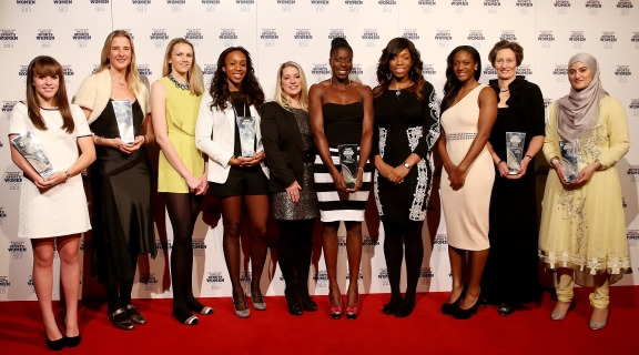 A diverse group of woman attending an awards event
