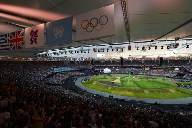 A stadium filled with spectators watching an athletics event