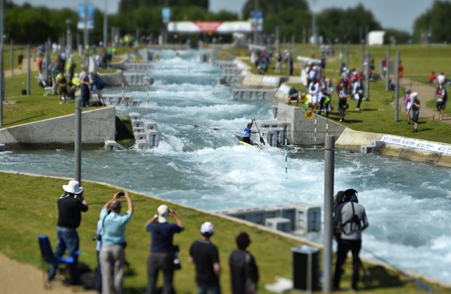 Spectators watch a canoeing event 