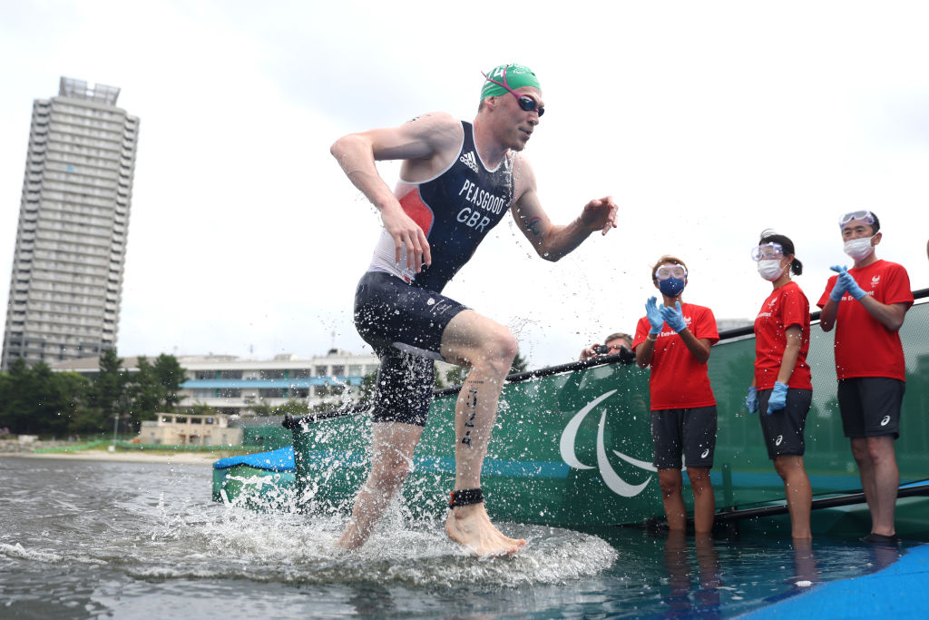 Peasgood running out of the water into the transition at Tokyo