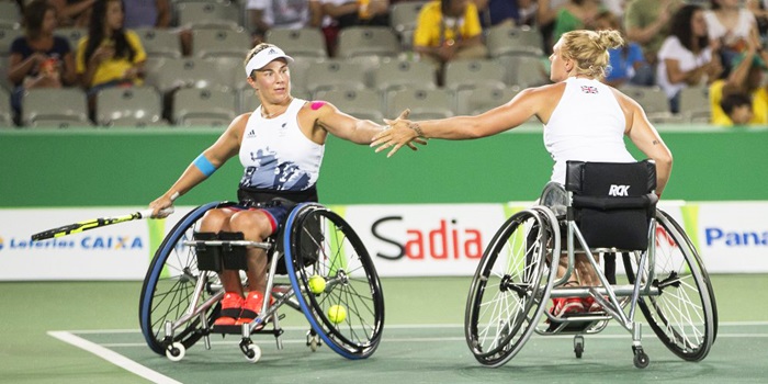 Athletes competing in wheelchair tennis