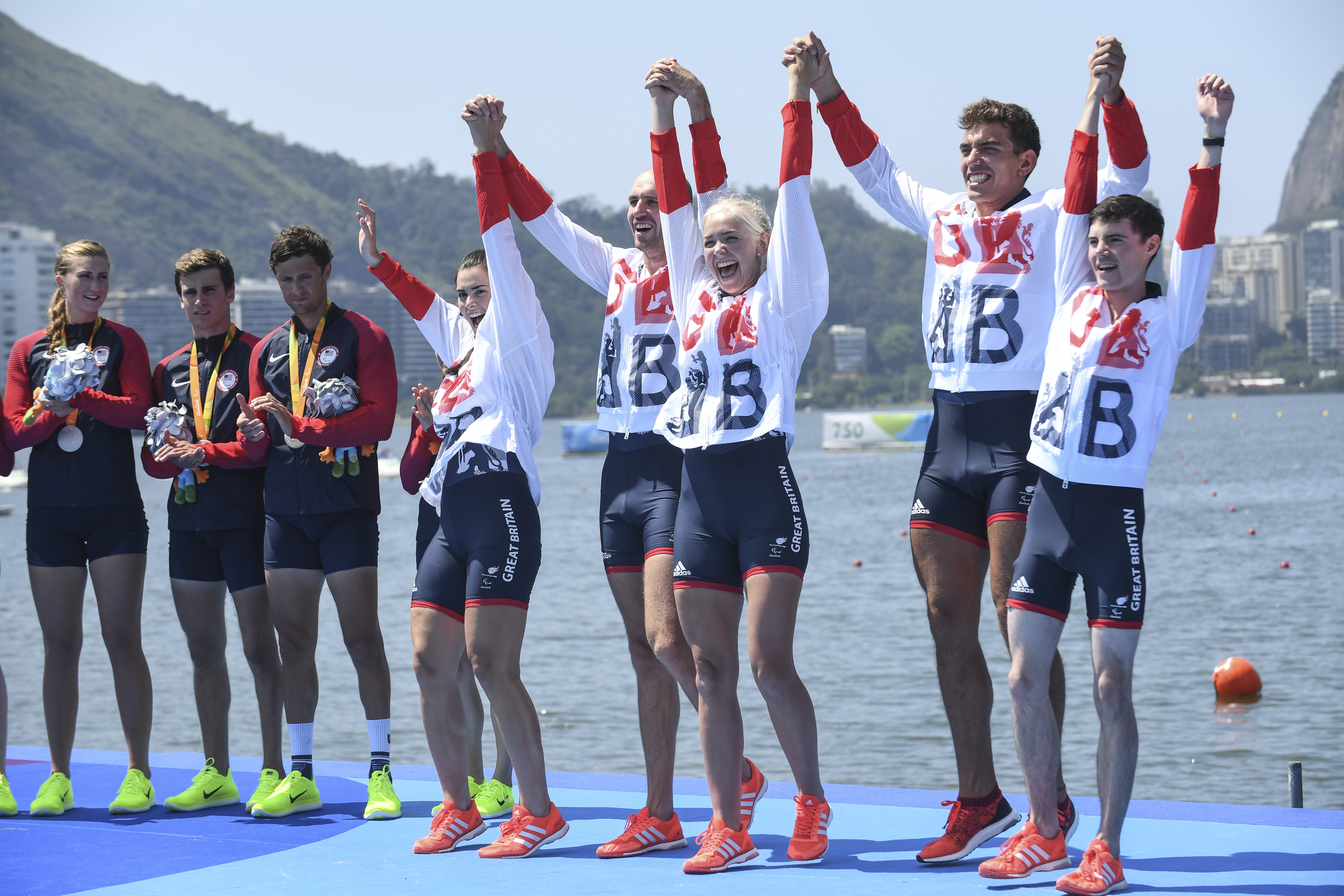 Para rowing athletes celebrate winning a medal at Rio 2016