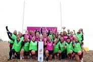 Community rugby players pose for a photo during the Women's Rugby World Cup 2025 in Brighton, England