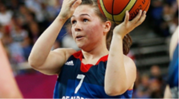 A British wheelchair basketball athlete lines up a shot