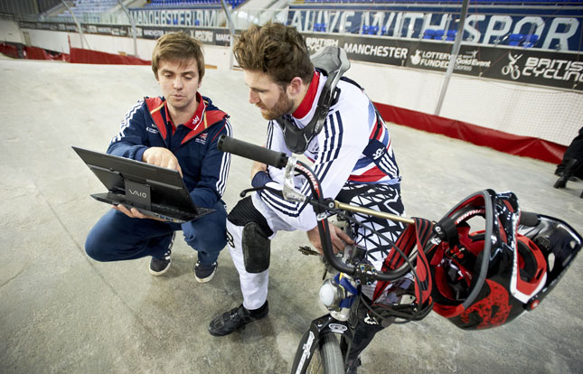 BMX athlete talking to coach