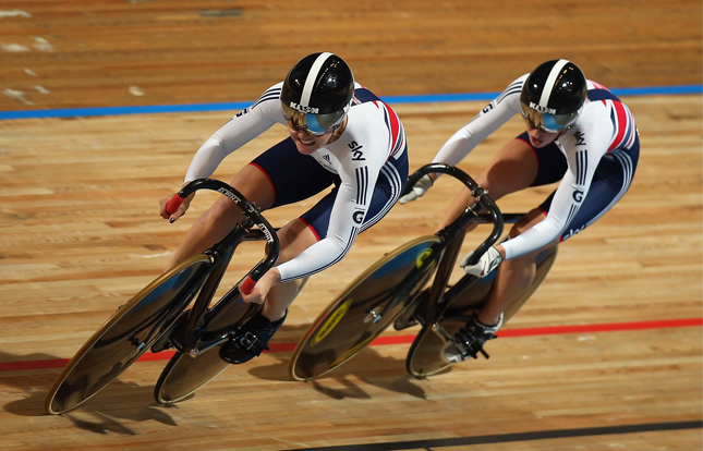 Athletes competing in track cycling race