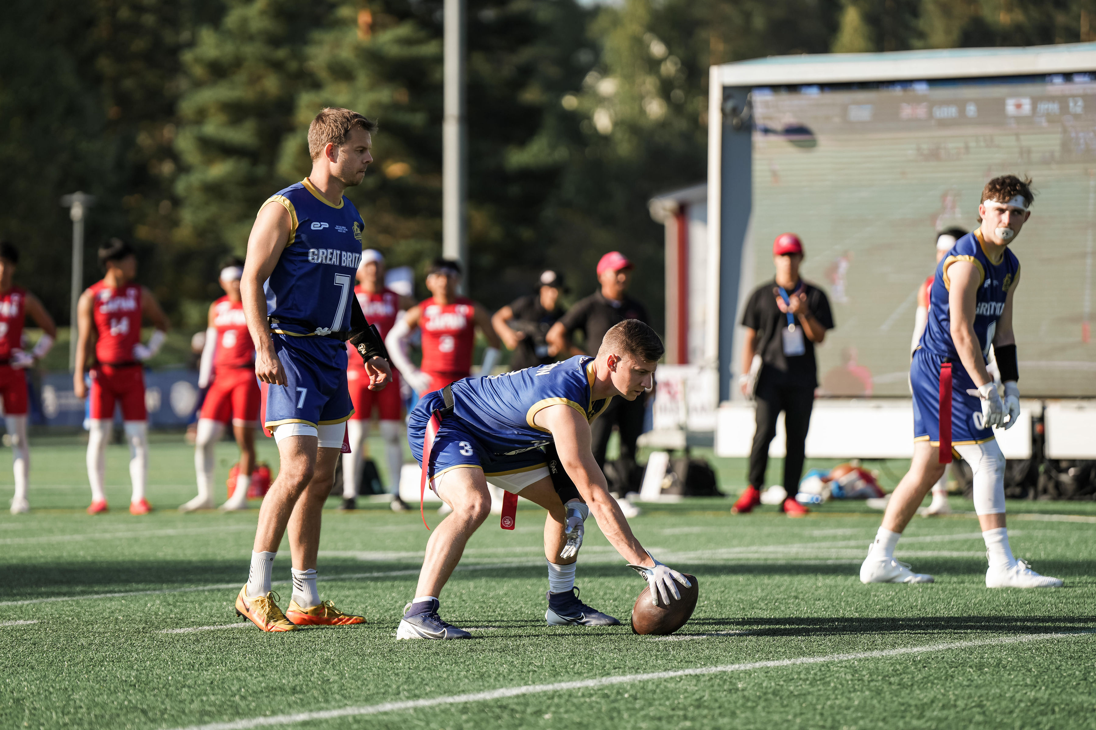 GB Men vs Japan, flag football, a player is ride to spike the ball.