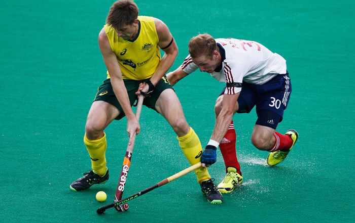 Two athletes playing hockey
