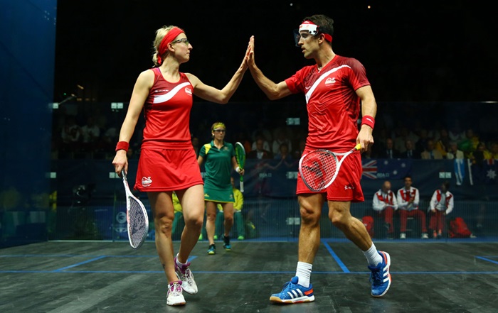 Two athletes playing squash