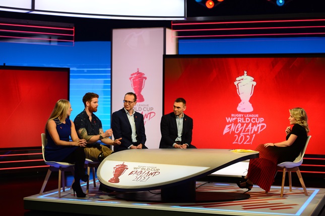 Five people sat in a television studio presenting the host cities for the Rugby League World Cup 2021