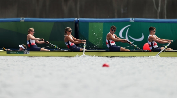 Ellen Buttrick, Giedre Rakauskaite, James Fox, Oliver Stanhope and Coxswain Erin Kennedy of Team Great Britain PR3 Mixed Coxed Four celebrate after winning the Gold meda