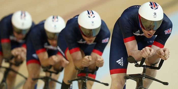 Athletes competing in track cycling race