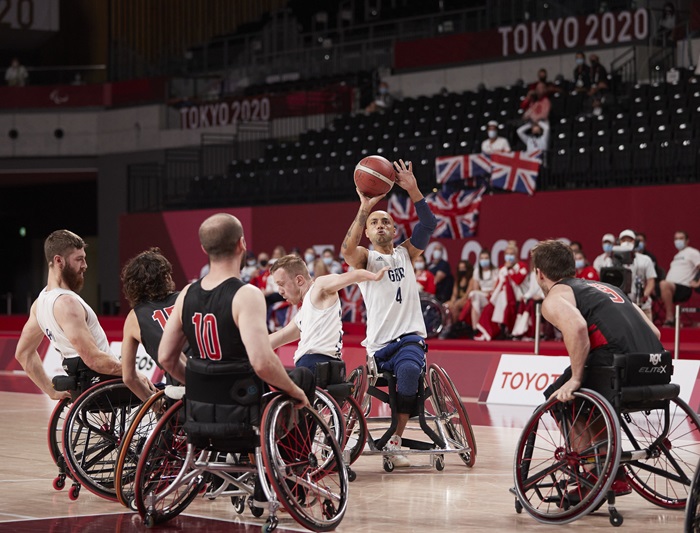 wheelchair rugby team celebrating in Tokyo