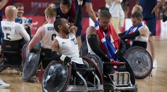 wheelchair rugby team celebrating winning gold in tokyo