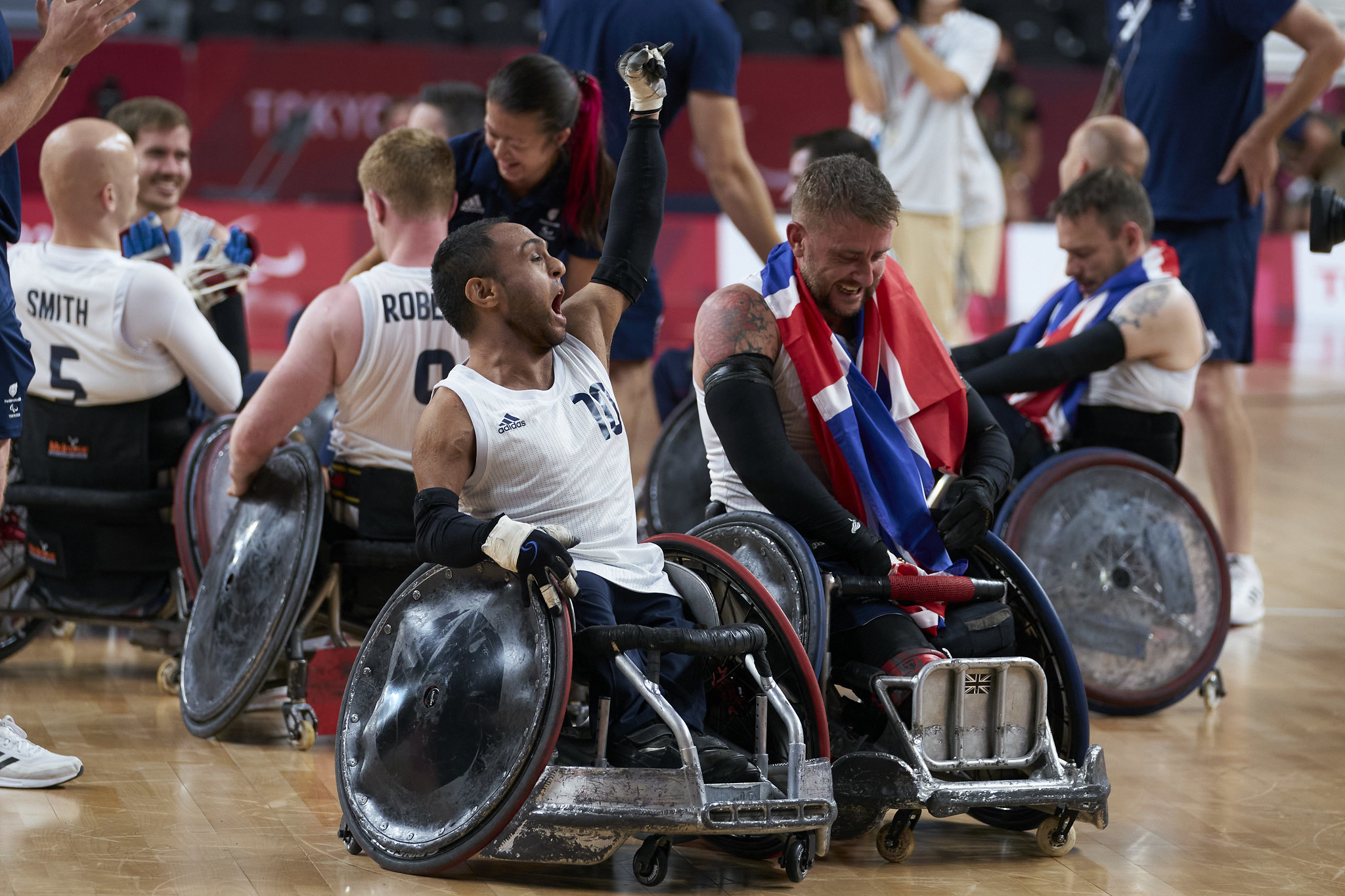 wheelchair rugby team celebrating winning gold in tokyo
