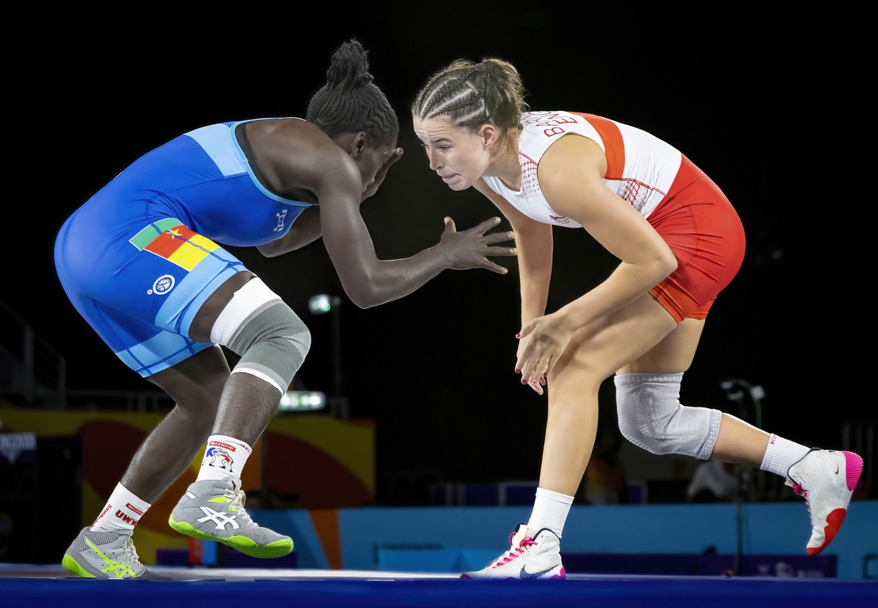 Two athletes participating in a wrestling match